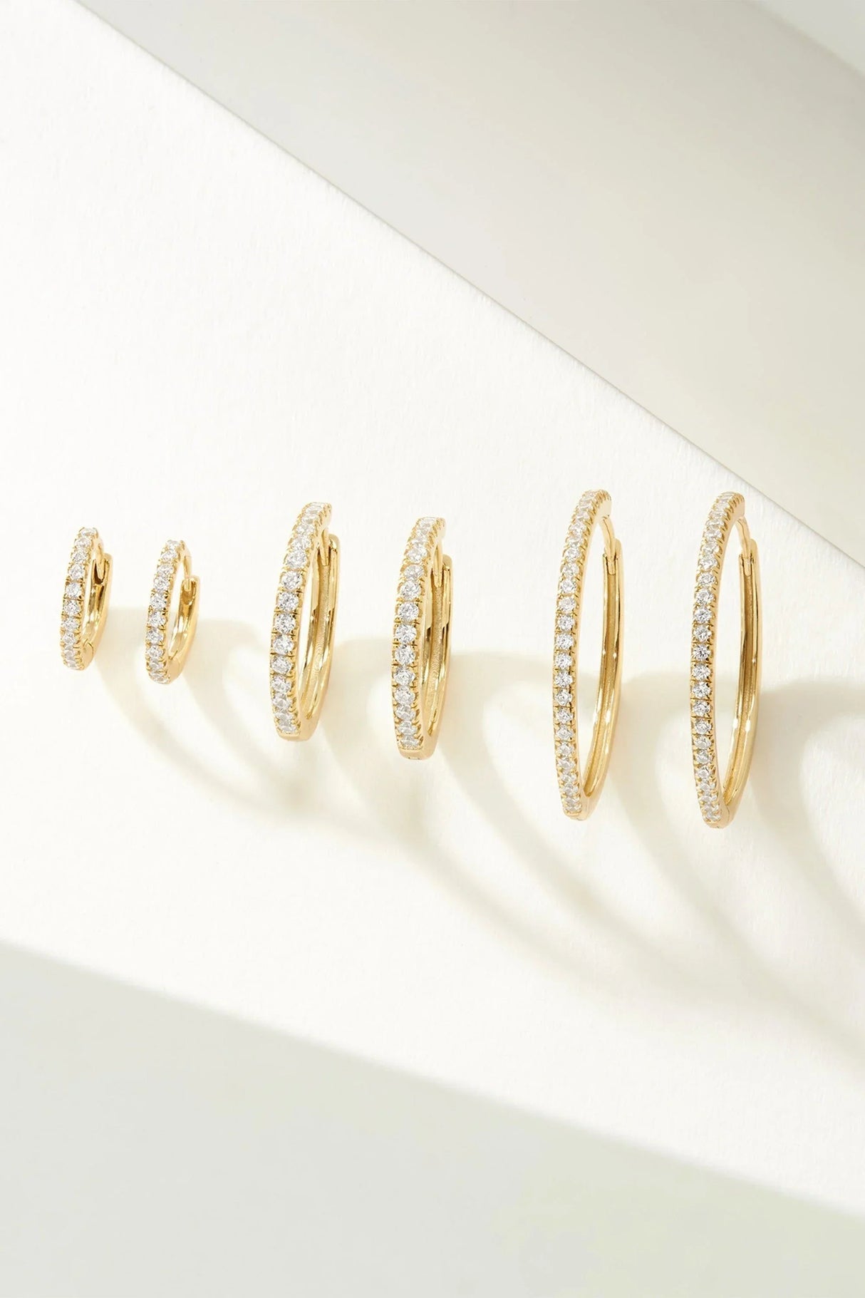 Micro CZ Huggie Hoop Earrings from eklexic