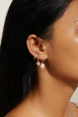 Oval Huggie Hoops With Pearl Drop Earrings from eklexic