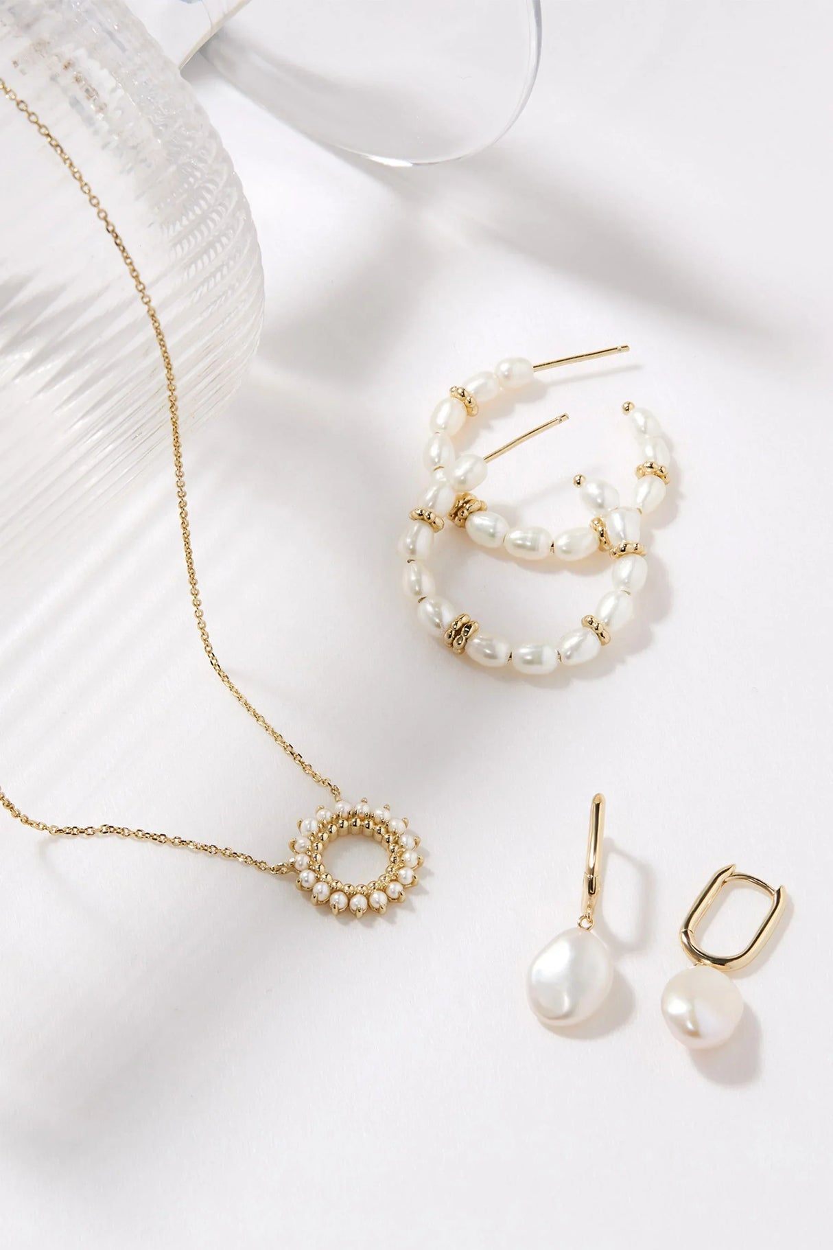 Oval Huggie Hoops With Pearl Drop Earrings from eklexic
