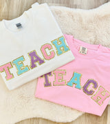 Teach Letter Patch Crewneck Sweatshirt from United Monograms