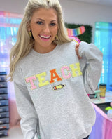Teach Pencil Letter Patch Crewneck Sweatshirt from United Monograms